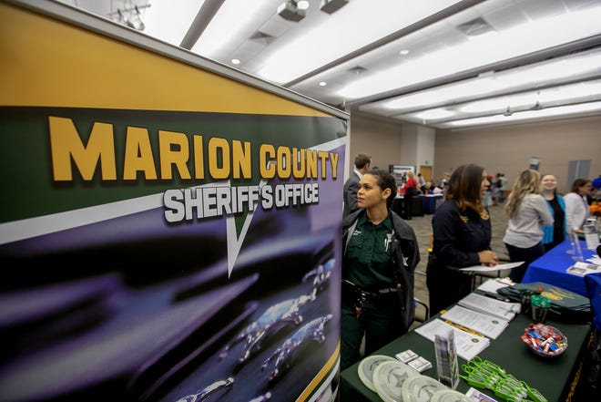 The Marion County Sheriff's Office has about 30 positions to fill and was on hand during the CareerSource CLM spring career fair at the Klein Center at the College of Central Florida in Ocala on April 5. More then 30 companies from around the region were there looking for employees. [Alan Youngblood/Ocala Star-Banner]