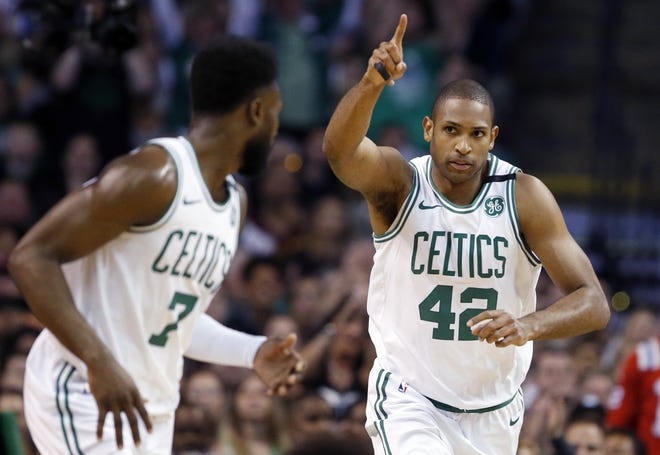 Boston Celtics forward Al Horford, right, celebrates a made basket with guard Jaylen Brown during the first quarter of Game 1 of the NBA Eastern Conference Finals against the Cleveland Cavaliers on Sunday. Boston won the game, 108-83. [AP PHOTO/MICHAEL DWYER]