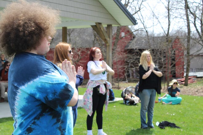 Adam Jewett, Casey Lukas, Samantha Miller and Jacinda Marsh take part in the adult yoga demonstration.