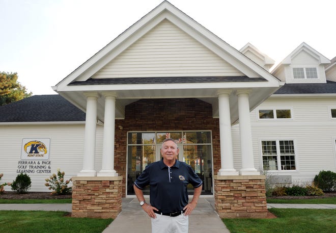 Herb Page, currently in his 40th year as head coach of the perennial national powerhouse Kent State men's golf program, stands in front of the Ferrara and Page Golf Training and Learning Center on Powdermill Road.