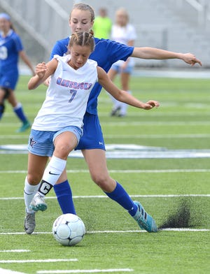 Southside's Kelly Carson works the ball around Rogers' Ashlynn Robinson during a semifinal match Saturday, May 12, 2018, in the 7A state soccer tournament at Rogers High School. [BRIAN D. SANDERFORD/TIMES RECORD]