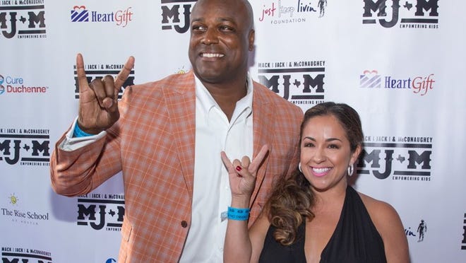 Cory Redding and his wife, Priscilla pose on the red carpet during the Mack, Jack & McConaughey (MJ&M) Gala held at ACL Live on April 14, 2016. Suzanne Cordeiro for American-Statesman