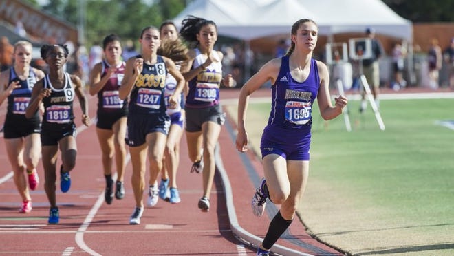 Bailey Goggans of Marble Falls takes the lead in the girls Class 5A 800-meter run during the UIL state track and field meet Friday at Myers Stadium. AMANDA VOISARD / AMERICAN-STATESMAN