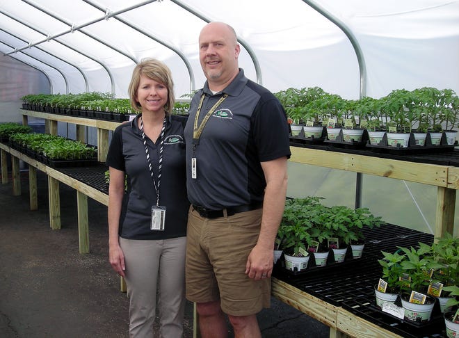 Cindy and Scott Jerousek are pictured in the greenhouse of the lawn and garden center at Farm and Home Hardware. In six months of ownership the Jerouseks have made several changes to the downtown Ashland fixture while relying on customer input.