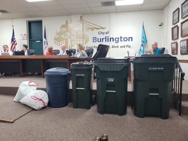 Burlington city staff brought trash can options for the Burlington City Council to consider during the council's Monday work session. From left, the first can is the city's current 33-gallon model followed by 35-gallon, 65-gallon and 95-gallon models. [Tanner Cole/thehawkeye.com]