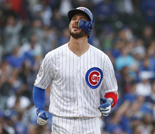 The Chicago Cubs' Kris Bryant reacts after lining out against the Atlanta Braves' A.J. Minter during the ninth inning of Monday's, game, in Chicago. [AP Photo/Kamil Krzaczynski]