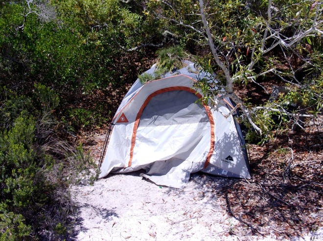 A 64-year-old homeless urban camper set up a tent at Topsail Hill State Preserve. [CONTRIBUTED PHOTO]