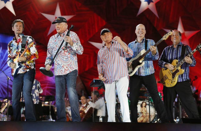 The Beach Boys, including original members Mike Love, second from left, and Bruce Johnston, third from left, perform at the Hatch Shell on the Esplanade in Boston, Thursday, July 3, 2014. [MICHAEL DWYER/THE ASSOCIATED PRESS]