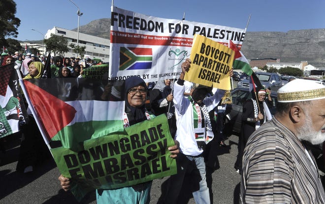 Protesters take part in a march to parliament in Cape Town, South Africa, Tuesday to protest against the use of the deadly force by Israeli troops against Palestinians at the Gaza border on Monday. [AP Photo/Nasief Manie]