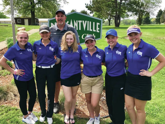 Van Meter girls’ golf team posing after they won the Pleasantville sectional on Monday, May 14.