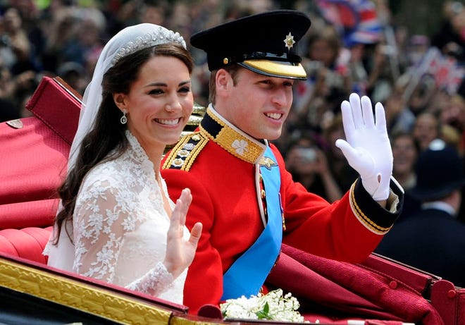 Britain's Prince William and his bride Kate, Duchess of Cambridge, leave Westminster Abbey, London, following their wedding, Friday April 29, 2011. (AP Photo/Tom Hevezi)