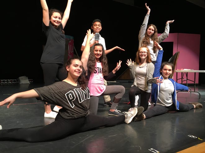 Kuss Middle School Theatre will present “Hairspray Jr.,” Friday, May 18 at 7 p.m. and Saturday, May 19 at 2 p.m. and 7 p.m. Pictured here, Corny Collins (Lander Dayao) and the students portraying dancers on the Corny Collins Show, front row from left: Maylin Mayo, Ema Mello; center: Emily Coelho, Alexis Frenette; back row: Olivia de Mello, Lander Dayao and Isabella Tiburtino. [Herald News photo | Linda Murphy]