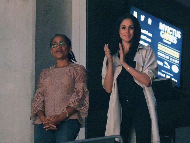 In this Saturday, Sept. 30, 2017 file photo, Meghan Markle, right, watches the closing ceremonies of the Invictus Games with her mother Doria Ragland in Toronto.