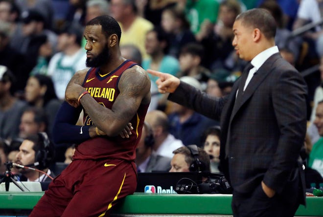 Cavaliers coach Tyronn Lue speaks to LeBron James during a timeout in the first half on Tuesday night.