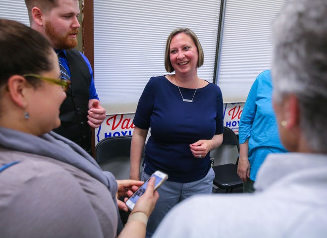 East Lane commissioner candidate Heather Buch talks with supporters at the Carpenters Local Union No. 271 on Tuesday night. [Brian Davies/The Register-Guard]