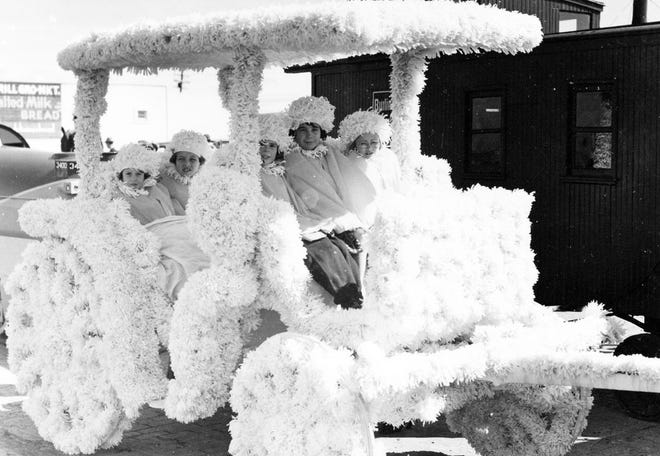 Girls ride on the Carson County Float entry at the Mother-In-Law Day Parade in 1938.