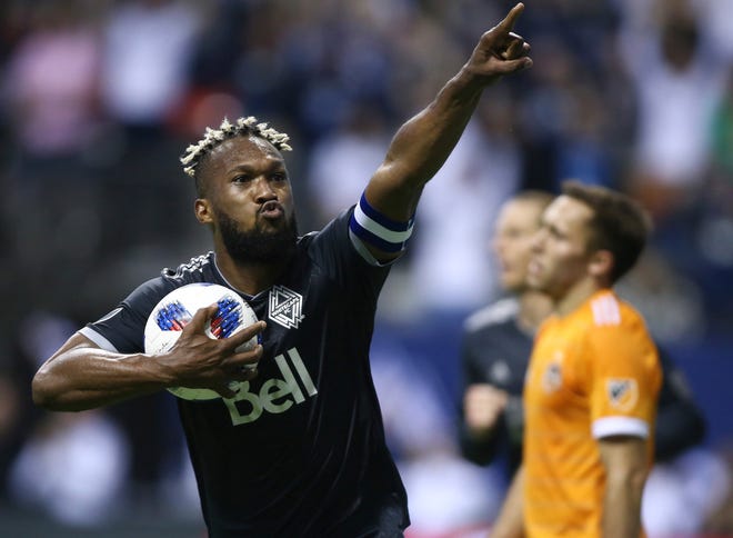 FILE - In this Friday, May 11, 2018, file photo, Vancouver Whitecaps defender Kendall Waston celebrates his goal against the Houston Dynamo during the second half of an MLS soccer match in Vancouver, British Columbia. Waston was selected for Cost Rica's 23-man roster for the World Cup in Russia. (Ben Nelms/The Canadian Press via AP, File)