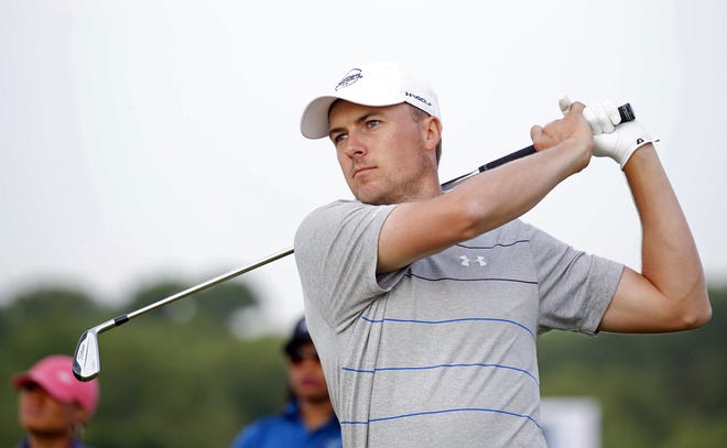 Jordan Spieth watches his ball after hitting from the fairway on the first hole during the pro-am at the AT&T Byron Nelson golf tournament at Trinity Forest Golf Club in Dallas on Wednesday. [VERNON BRYANT/THE DALLAS MORNING NEWS VIA AP]
