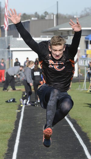 North Canton Hoover freshman Max Stokey competes in the long jump earlier this track season. A federal judge has ruled in favor of the district following the family's request that Max be reinstated to the pole vault program at Hoover. (CantonRep.com / Michael Balash)