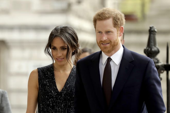 Britain's Prince Harry and his fiancee Meghan Markle arrive to attend a Memorial Service to commemorate the 25th anniversary of the murder of black teenager Stephen Lawrence at St Martin-in-the-Fields church in London on April 23, 2018. (AP Photo/Matt Dunham, file)