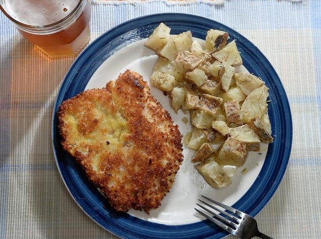 Fish and potatoes are prepared using British recipes. [Greg Wohlford/Erie Times-News]