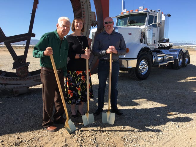 Arizona Pipeline officials break ground on the company’s new corporate office building in Hesperia. Pictured left to right: Company founder Duane Moyers, president Nina Moyers and vice president David Syfrig. [Rene Ray De La Cruz, Daily Press]