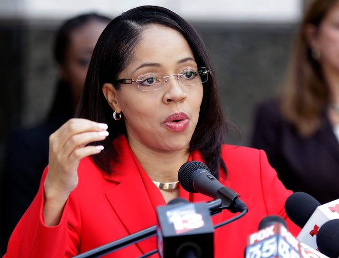 In this Sept. 1, 2017 file photo, Florida State Attorney Aramis Ayala answers questions during a news conference in Orlando. The Florida prosecutor who got into a legal fight with the governor for her blanket refusal to seek the death penalty now says her office will no longer request monetary bail bonds for defendants accused of low-level crimes. “By primarily relying on money, our bail system has created a poverty penalty that unjustifiably discriminates against those without resources to pay,” Ayala said in a statement Wednesday, May 16, 2018 announcing the change. (AP Photo/John Raoux, file)