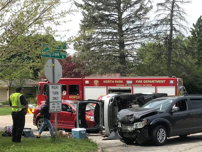 Fire personal attend to a three-vehicle accident at the intersection of Spring Creek and Spring Brook Road on Thursday, May 17, 2018. [ISAAC GUERRERO/RRSTAR.COM STAFF]