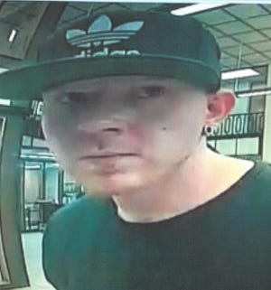 The suspect in a bank robbery that occurred at the Bank of the Ozards in Kings Mountain on Thursday is seen in this surveillance video image. [Special to The Star]
