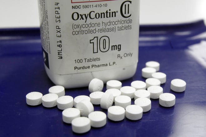 OxyContin pills arranged for a photo at a pharmacy in Montpelier, Vt. (AP Photo/Toby Talbot, File)