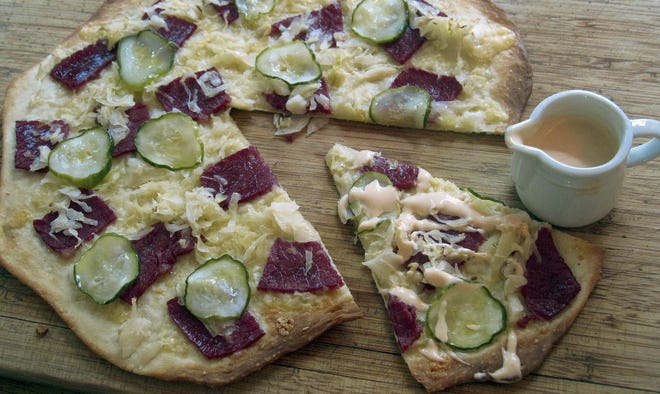This Reuben pizza is from a recipe by Sara Moulton. (Sara Moulton via AP)