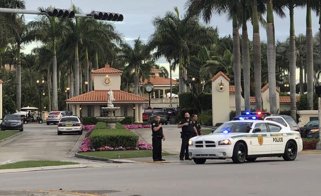 Police respond to The Trump National Doral resort after reports of a shooting inside the resort Fridayin Doral. [AP Photo/Frieda Frisaro]