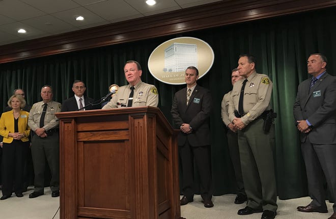 Los Angeles County Sheriff Jim McDonnell talks during a news conference in Los Angeles on Friday. Sheriff's officials have made an arrested after a woman was fatally stabbed inside her car in the parking lot of a Southern California shopping mall. McDonnell said Friday that Victorville resident Cherie Townsend was arrested on suspicion of murder in connection with the May 3 stabbing. [Mike Balsamo, Associated Press]