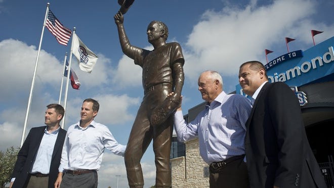 Nolan Ryan, second from right, poses for a portrait at the unveiling of a statue of himself at Dell Diamond on Nov. 1, 2016. With Ryan are (from left), Tim Jackson, Round Rock Express general manager; Ryan’s son Reese, CEO of Ryan Sanders Baseball and the Express; and Chris Almendarez, president of the Express. ANDY SHARP/FOR AMERICAN-STATESMAN