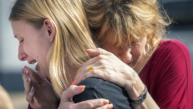 Santa Fe High School student Dakota Shrader is comforted by her mother Susan Davidson following a shooting at the school on Friday, May 18, 2018, in Santa Fe, Texas. Shrader said her friend was shot in the incident.