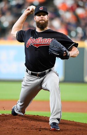 Cleveland Indians starting pitcher Corey Kluber delivers during the first inning of the team's baseball game against the Houston Astros, Saturday, in Houston.