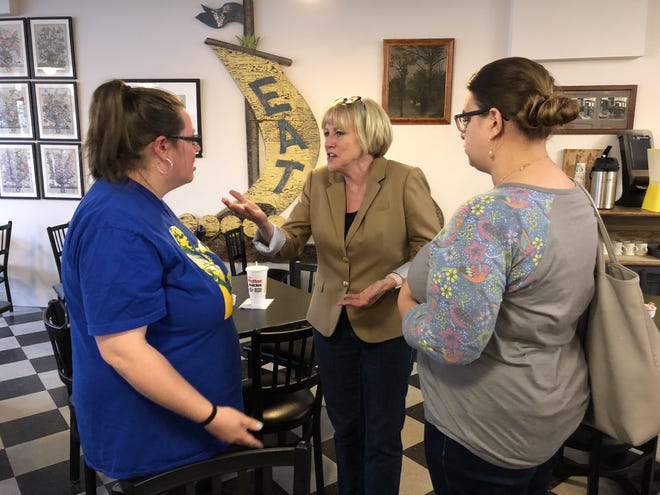 Cathy Glasson, a Democratic candidate for governor of Iowa, talks with Phoebe McNeece, left, and Alexandra Rucinski, right, following a campaign event Friday evening at the Uptown Ivy in Burlington. Glasson is one of six Democrats running to unseat GOP Gov. Kim Reynolds. [Elizabeth Meyer/thehawkeye.com]