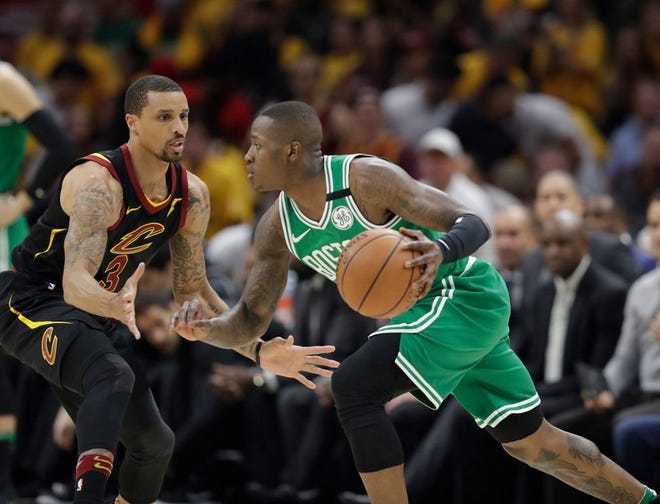 Terry Rozier tries to drive past the Cavaliers' George Hill in the first half of Saturday night's Game 3 of the Eastern Conference finals.