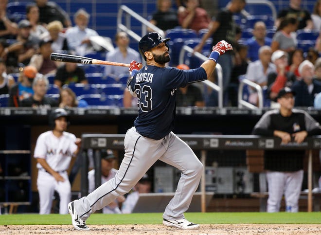 FILE - In this May 10, 2018, file photo, Atlanta Braves' Jose Bautista bats during the fourth inning of a baseball game against the Miami Marlins in Miami. The Braves have released Bautista a month after picking up the veteran slugger and will make Johan Camargo their starting third baseman. (AP Photo/Wilfredo Lee, File)