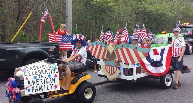 A parade float makes it way along the Westport Fouth of July parade route. While this float would be considered family friendly, some selectmen voiced concern about regulating floats that might not meet that standard. [Herald News File Photo]