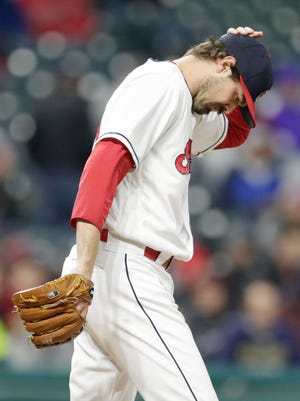 Cleveland Indians relief pitcher Andrew Miller reacts after Kansas City Royals' Salvador Perez hit a two-run home run during the seventh inning of a baseball game Friday, May 11, 2018, in Cleveland. (AP Photo/Tony Dejak)