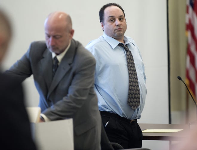 Joshua Flynn stands up during a break during day six of his trial in Strafford County Superior Court on Monday afternoon. Flynn is accused of sexually assaulting a woman at Emery Farm in Durham, tying her and two other women up and robbing all three on March 10, 2017. [John Huff/Fosters.com]