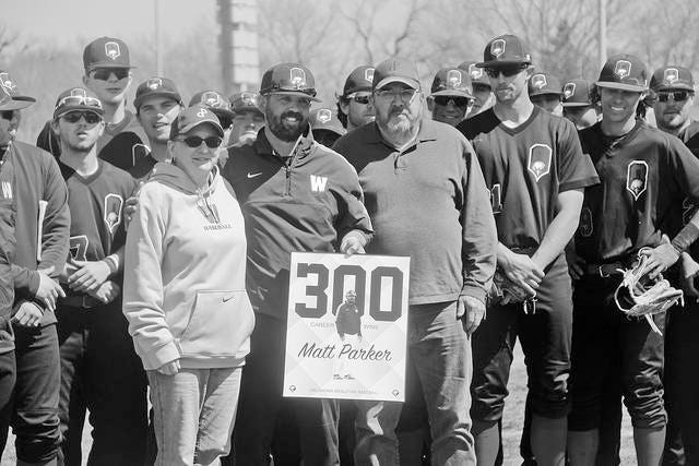 Oklahoma Wesleyan baseball coach Matt Parker is flanked last March by his parents Ginger and Dale following Parker’s 300th career victory. He finishes up his Eagle tenure with 325 wins. Mike Tupa/Examiner-Enterprise