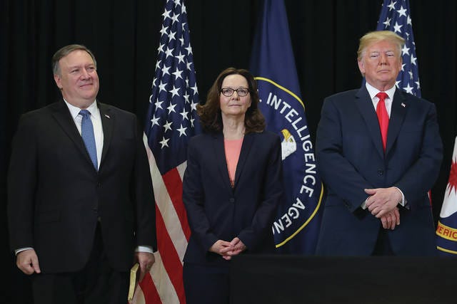 U.S. Secretary of State Mike Pompeo, from left, Gina Haspel and President Donald Trump attend the swearing-in ceremony for Haspel as CIA director at agency headquarters on Monday in Langley, Virginia. Last week the Senate confirmed Haspel to replaced Mike Pompeo who was sworn in as Secretary of State earlier this month. Mark Wilson/Sipa USA/TNS
