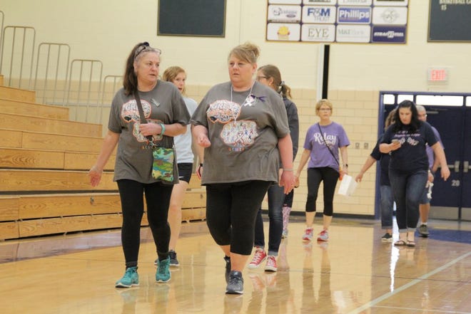 Lacy Derigo and Shawn Statler of team Grey Matters circled the Greencastle-Antrim High School gym during the Relay for Life. JOHN IRWIN/ ECHO PILOT.