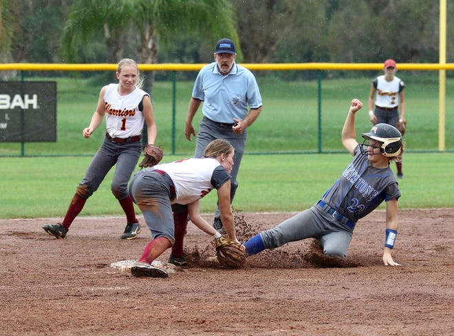 Emily Dixon tags out Keystone Heights' Bailey Story at second base during the Class 5A softball state semifinals on Tuesday in Vero Beach. West Nassau won 4-1. [Brian LaCross, For the Times-Union]