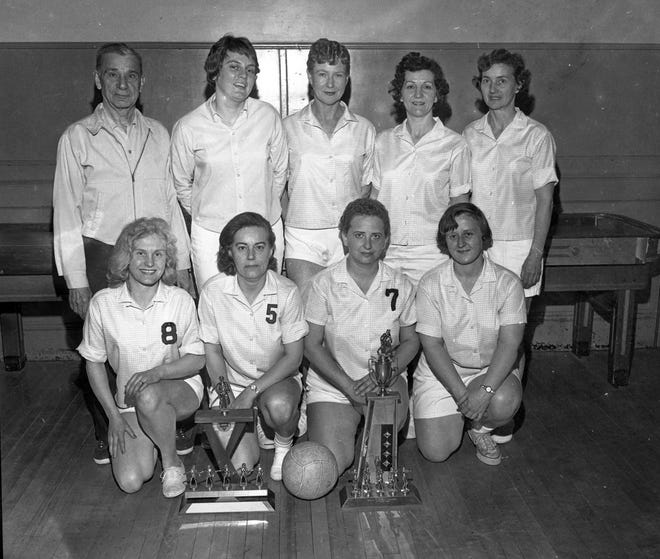 The very successful 1964 Fall River YMCA women’s volleyball team. Pictured (left to right) are: front – Loretta “Sis” Swanson, captain Emma Morrissette, Lorraine Saraiva, Sylvia Powell; rear – coach George Wuchter, Carol Burns, Ruth Pereira, Bernie Littlefield, Marion Gonsalves. Missing from photo team member Muriel Hadley. [Herald News archives \ Norm Fontaine]