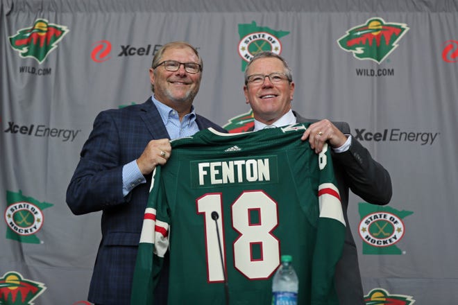 Minnesota Wild NHL hockey team owner Craig Leipold, left, poses with new general manager Paul Fenton during an introductory press conference in St. Paul, Minn., Tuesday, May 22, 2018. (Shari L. Gross/Star Tribune via AP)