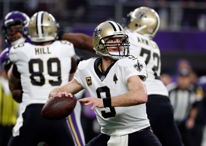 New Orleans Saints quarterback Drew Brees (9) throws against the Minnesota Vikings during the first half of an NFL divisional football playoff game in Minneapolis, Sunday, Jan. 14, 2018. (AP Photo/Jeff Roberson)