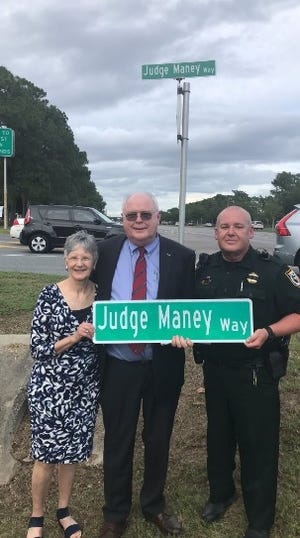 Judge T. Patterson Maney celebrates a road dedicated in his name. [OKALOOSA COUNTY SHERIFF'S OFFICE/CONTRIBUTED PHOTO]